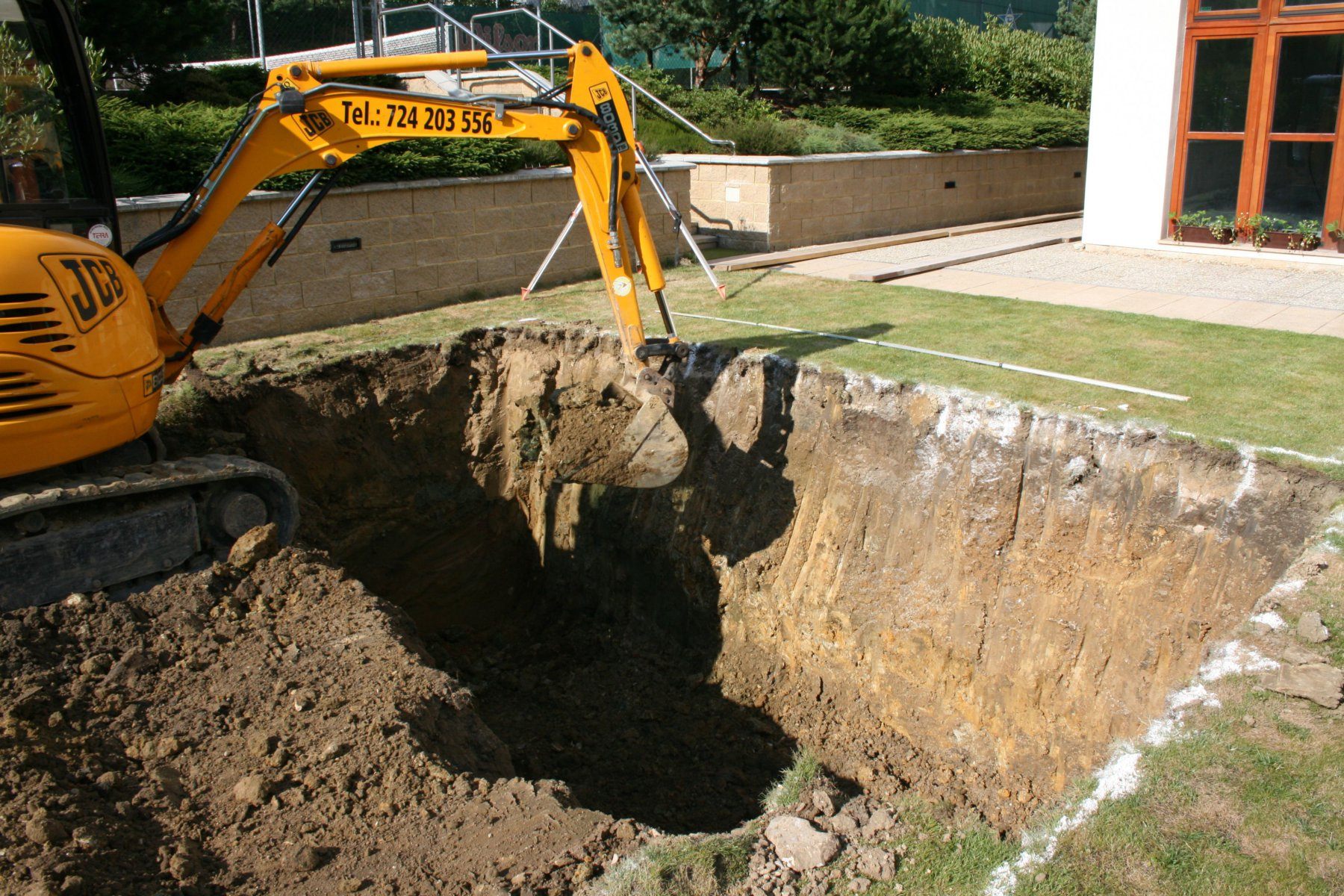 Ceramic pool installation – earth works with an excavator